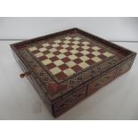 Inlaid chess board with chess pieces