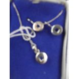 Silver pendant with matching earrings