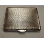 Silver engine turned cigarette case with gilded interior