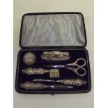 Late Victorian cased silver manicure set, repair s