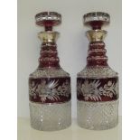 Pair of silver mounted flash glass decanters, Lond