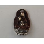 Oriental Buddha figure with gold and silver finish