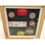 Shadow box containing vintage tins