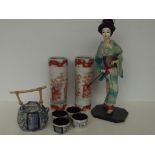 Saki set, Japanese doll and pair of Oriental spill