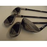 Three Nike golf clubs together with a Yonex five w