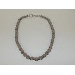 Necklace in the form of a bike chain