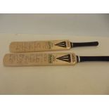 Two miniature cricket bats signed by the team of D