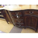 Regency style serpentine mahogany sideboard