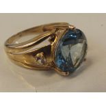 9 ct yellow gold dress ring with large blue centra