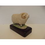 Porcelain model champion sheep on wooden plinth