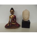 Seated Buddha together with a stone bust