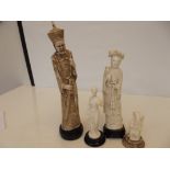 Four simulated ivory figures in resin, largest fig