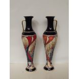 Pair of Moorcroft Red Dot jugs. Height 31cm