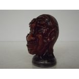 Oriental Amber and Silver Bust. The face made up o