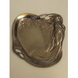 Art nouveau style pewter dish depicting a sinuous