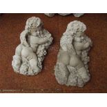 Two cherub garden ornaments