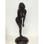 Large bronze figure of a naked lady on a marble pl