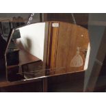 1940's peach tinted wall mirror with etched decora