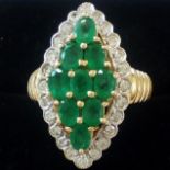14ct gold diamond and Emerald ring. 9 oval cut eme