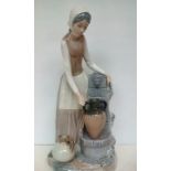 Nao figure of a lady at a drinking fountain - Boxe
