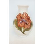 Moorcroft vase in the Coral Hibiscus pattern, 20 cm in height