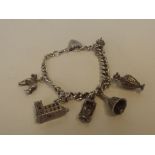 Silver charm bracelet with 6 charms 70grams