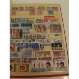 Red stock book full of Ceylon and Sri Lanka stamps