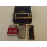 Cased Ronson lighter with three others