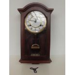 Highlands mahogany cased wall clock, with key and