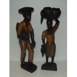 Pair of ethnic carved figures largest 49cm