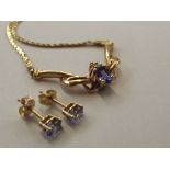 14ct yellow gold sixteen inch Tanzanite and Diamond necklace incorporating a lobster claw clasp and