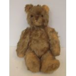 Early teddy bear possibly straw filled, with worki