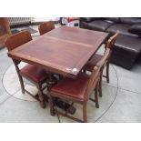 Oak drawer leaf table and four chairs with cup and