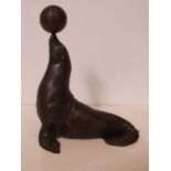 Bronze figure of a performing sealion, signed, hei