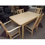 H.J Berry light wood dining table and four chairs