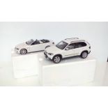 Two boxed BMW model cars