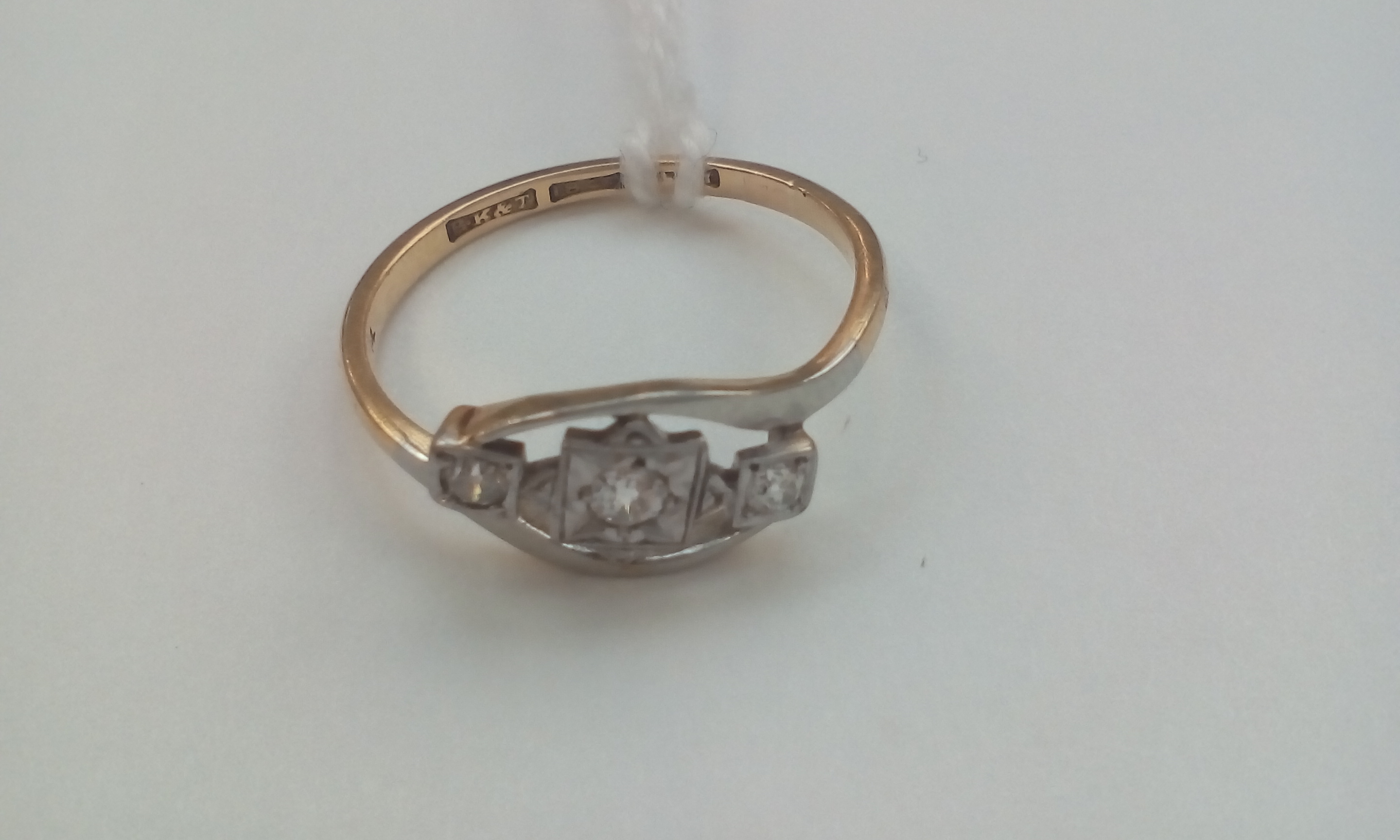 18 carat gold ring set with with three stones, siz