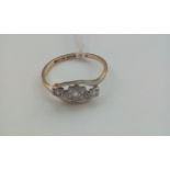 18 carat gold ring set with with three stones, siz