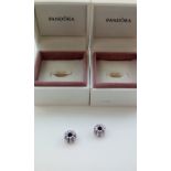 Two Pandora charms, boxed