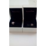 Two Pandora charms, boxed