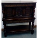 Jacobean style oak court cupboard with cup and cov