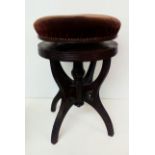 A Edwardian rise and fall mahogany piano stool