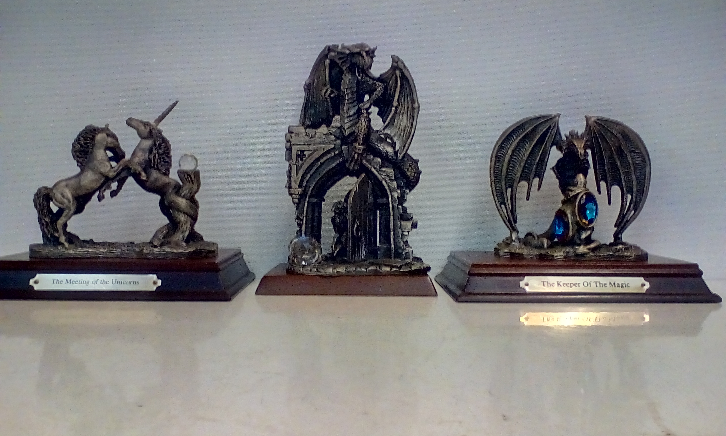 Three large Myth and Magic figures on plinth bases