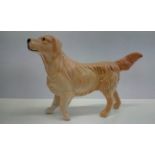 Beswick figure of a Golden Retriever, modelled with front paw raised, height 6.5cm