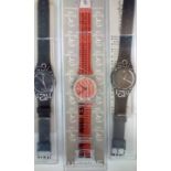 Three Swatch watches, all cased and working