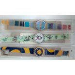 Three Swatch watches, all cased and working