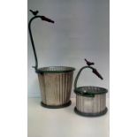 Two aluminium tap planters, height of largest exam