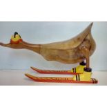 Treen figure of a duck on skis, length 44cm