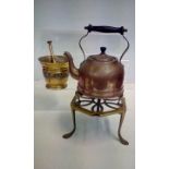 Vintage copper kettle on stand together with a pes