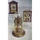 Two mantel clocks together with an anniversary clo